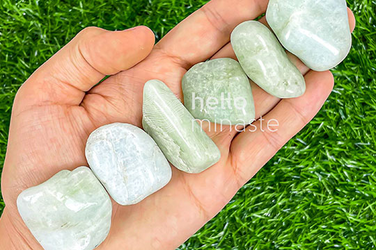 greenish aquamarine stone on hand