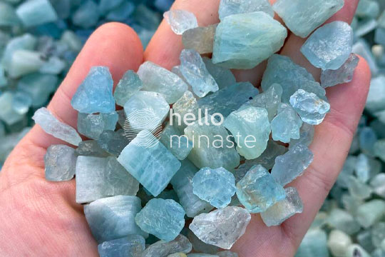 tiny blue aquamarine crystals on hand